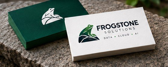 Frogstone Solutions business cards in green and white, stacked on a stone surface